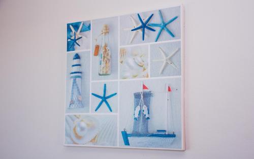 a picture of a collage ofautical items on a wall at High Tide in Amanzimtoti