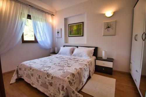 Postel nebo postele na pokoji v ubytování Apartments SI