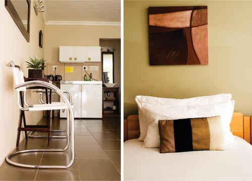 ボーフォート・ウェストにあるHaus Holzapfelのベッドとキッチン付きの部屋