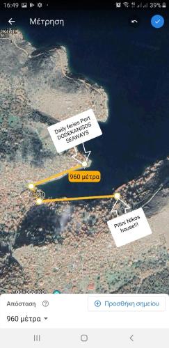 a screenshot of a website with descriptions of an island at Pitini Nikos house in Symi