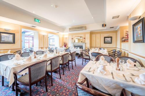 a row of tables and chairs in a restaurant at The Bosun in Monkstown