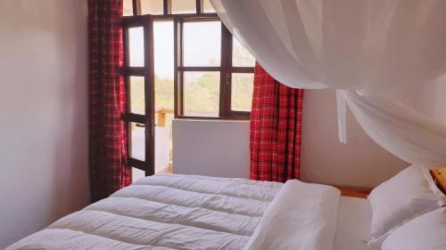 Postel nebo postele na pokoji v ubytování Merinja Guest House