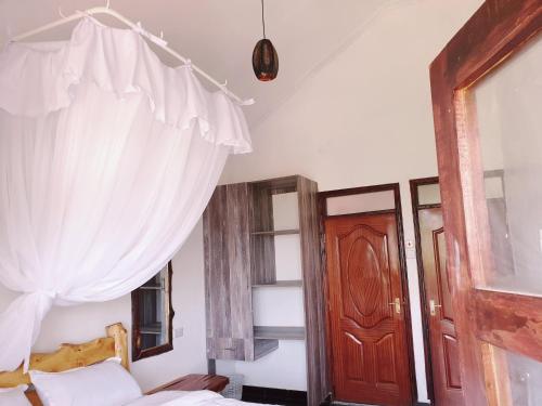 Postel nebo postele na pokoji v ubytování Merinja Guest House