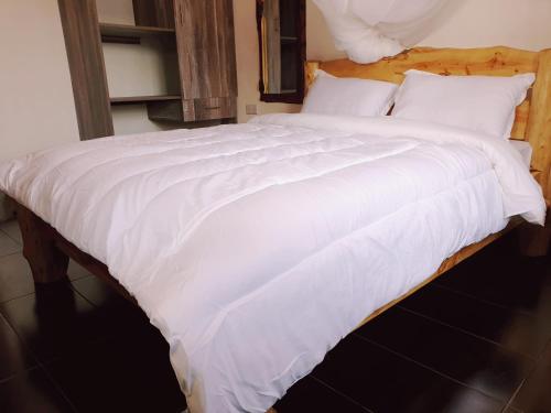 Postel nebo postele na pokoji v ubytování Merinja Guest House