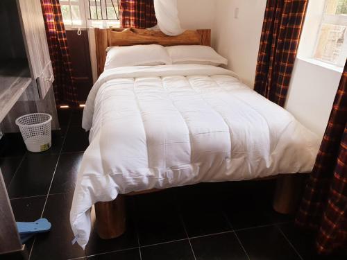 Postel nebo postele na pokoji v ubytování Merinja Guest House