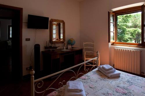 Postel nebo postele na pokoji v ubytování Casa Il Ceppo