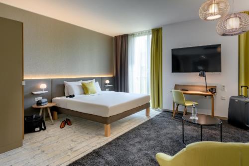 Postel nebo postele na pokoji v ubytování Novotel München Messe