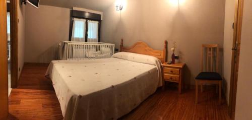 Una cama o camas en una habitación de Alojamiento Rural ELORTATXU