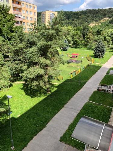 an overhead view of a park with trees and a sidewalk at JEDENAST.SK, Námestie kozmonautov 5 Apartmán in Košice