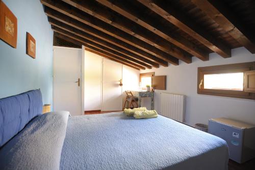 Un pat sau paturi într-o cameră la Arco Ubriaco