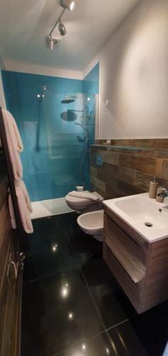 a bathroom with a toilet and a sink at The Bronze Pig in Lincoln