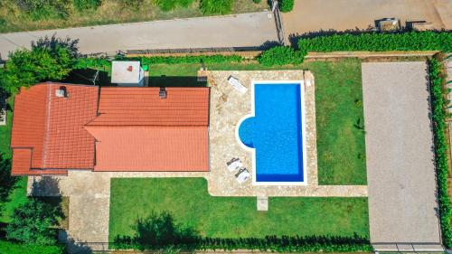 an overhead view of a house with a swimming pool at Villa Mirna in Mostar