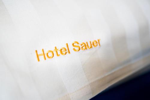 a close up of the word hotel swap written on a book at Hotel Sauer Garni in Neu Isenburg