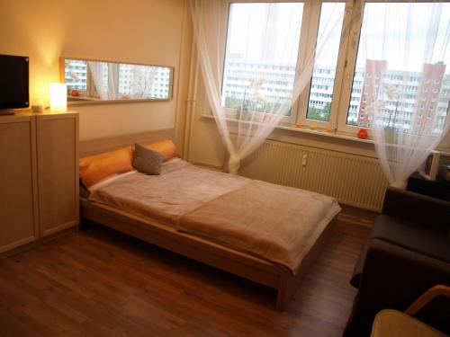 Ένα ή περισσότερα κρεβάτια σε δωμάτιο στο Apartment Rochstrasse Berlin