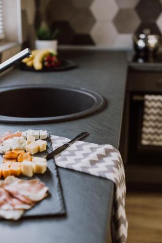 a plate of food on a counter with a knife at N95 in Bitola
