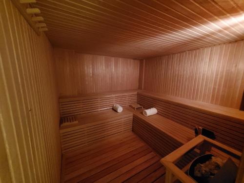an empty sauna with wood paneling and a wooden floor at Agua del Corral Hotel & Spa in Mendoza