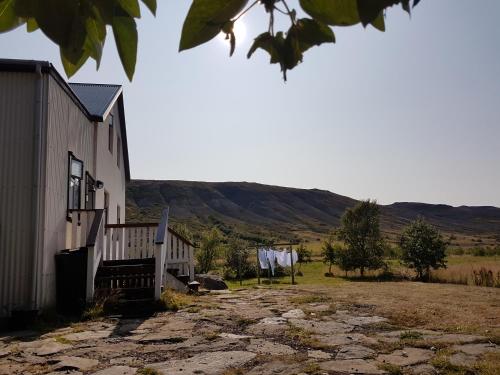 a building with clothes hanging on a clothes line at Guesthouse Gamli Bær in Húsafell