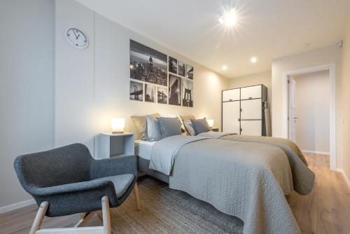Ένα ή περισσότερα κρεβάτια σε δωμάτιο στο Modern holiday apartment Vilnius