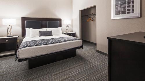 a hotel room with a bed and a desk at Best Western Plus Wilkes Barre-Scranton Airport Hotel in Pittston