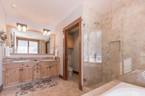 a bathroom with a shower and a sink at Luxury 4BD Village at Northstar Residence - Iron Horse South 412 in Truckee