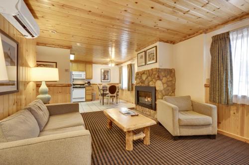 a living room with a couch and a fireplace at 3 Peaks Resort & Beach Club in South Lake Tahoe