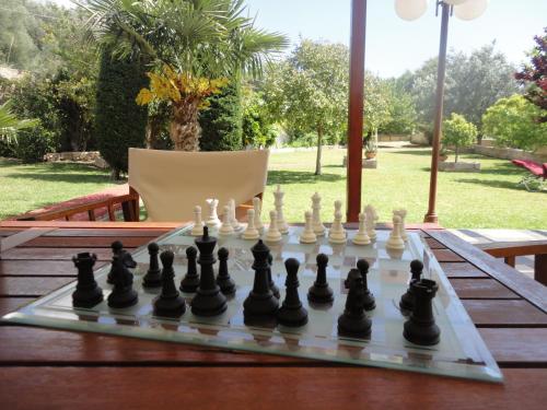 a chess board on a table with a chessboard at Villa Elpida in Svoronata