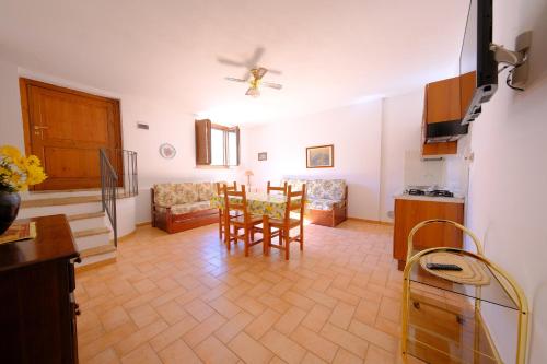 a kitchen and dining room with a table and chairs at Agriturismo Montegonfoli in San Gimignano
