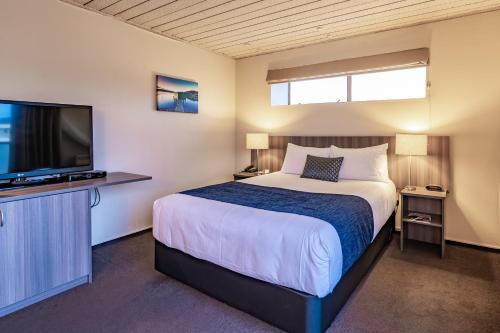 Postel nebo postele na pokoji v ubytování Kingsgate Hotel Dunedin