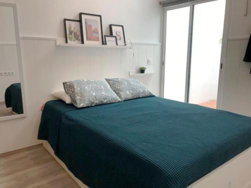 En eller flere senge i et værelse på Ideal Apartamento Tipo Loft en Triana Sevilla Wifi