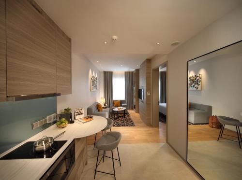 a kitchen and living room with a living room at Capri by Fraser Johor Bahru in Johor Bahru