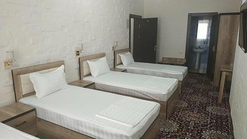 Krevet ili kreveti u jedinici u objektu Orient Star Hotel