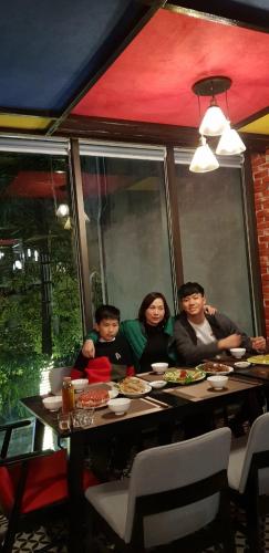 a group of people sitting at a table at Max Boutique Hotel in Cao Bằng