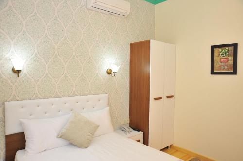 Krevet ili kreveti u jedinici u okviru objekta Dualis Hotel