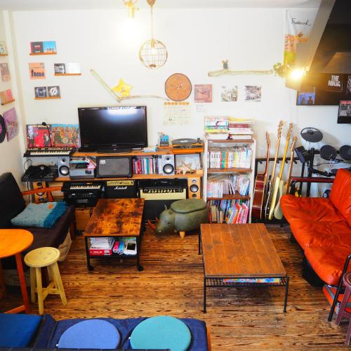 a living room filled with furniture and a tv at Tokushima GuestHouse【uchincu】 in Tokushima