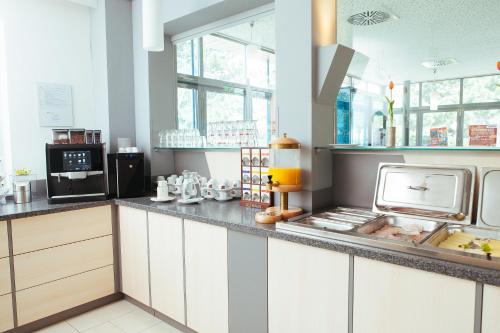 Kuchyň nebo kuchyňský kout v ubytování KSV Hotel Wien