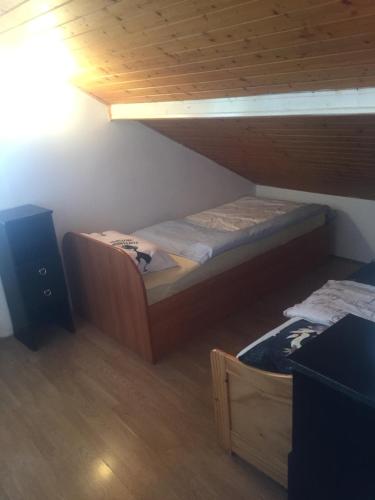 a small bedroom with a bunk bed and a speaker at Apartment Doderovic in Kostrena