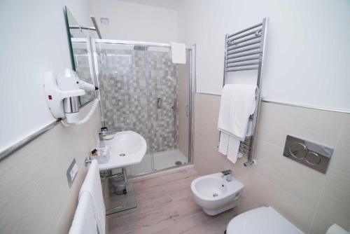 a bathroom with a toilet and a sink and a shower at B&B La Gemma di Ravello in Ravello