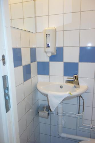 a bathroom with a sink and a toilet at Hotell Svanen in Kalmar