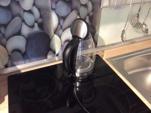 a whisk and a wine glass on a kitchen counter at Wenzel in Roxheim