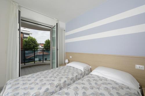 Ένα ή περισσότερα κρεβάτια σε δωμάτιο στο Skyresidence