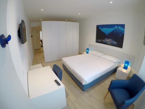 Кровать или кровати в номере La Casa sul Lago Lecco
