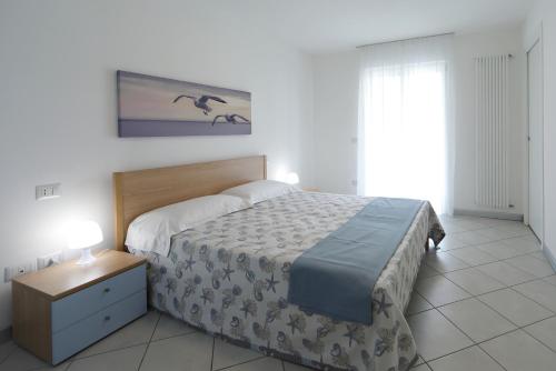 Ένα ή περισσότερα κρεβάτια σε δωμάτιο στο Skyresidence