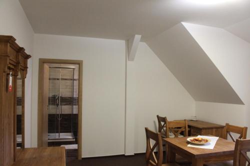 a dining room with a table and some chairs at Relax pension Schonwald in Budišov nad Budišovkou