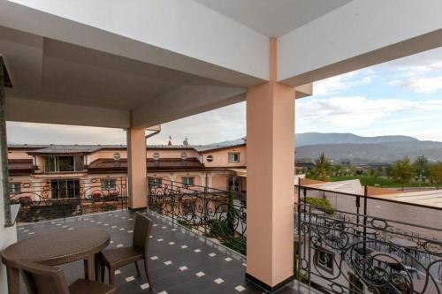 a balcony with a table and chairs on a building at L' Araba Fenice Hotel & Resort in Altavilla Silentina