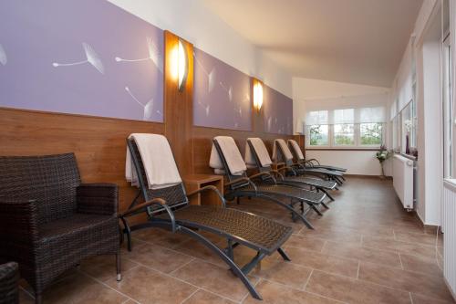 a row of chairs in a waiting room at Resort-Restaurant Stilec in Kamenný Újezd