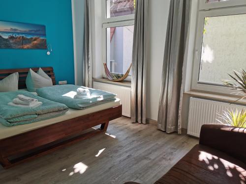 Cama ou camas em um quarto em Gästehaus Twee Linden