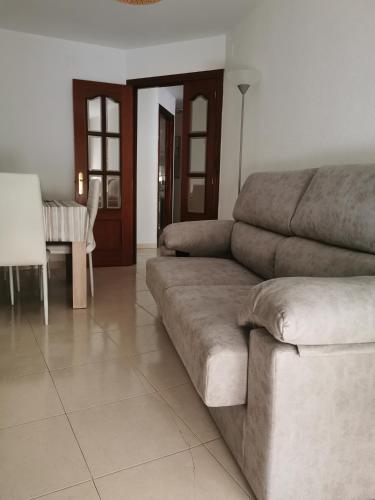 a living room with a couch and a table at Malocar in Arévalo