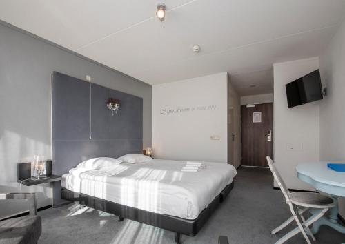 Postel nebo postele na pokoji v ubytování Fletcher Hotel Landgoed Avegoor