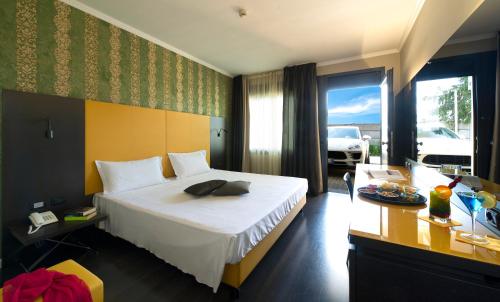 A bed or beds in a room at Hotel D120
