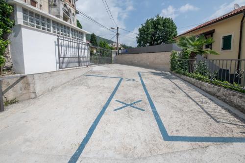 an empty street with blue lines on the road at Studio apartman Tasha in Opatija